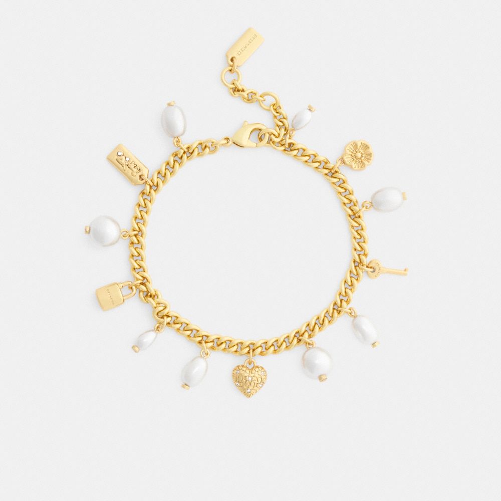 Женские брелоки Coach Pearl And Heart Charm Bracelet — фото 2