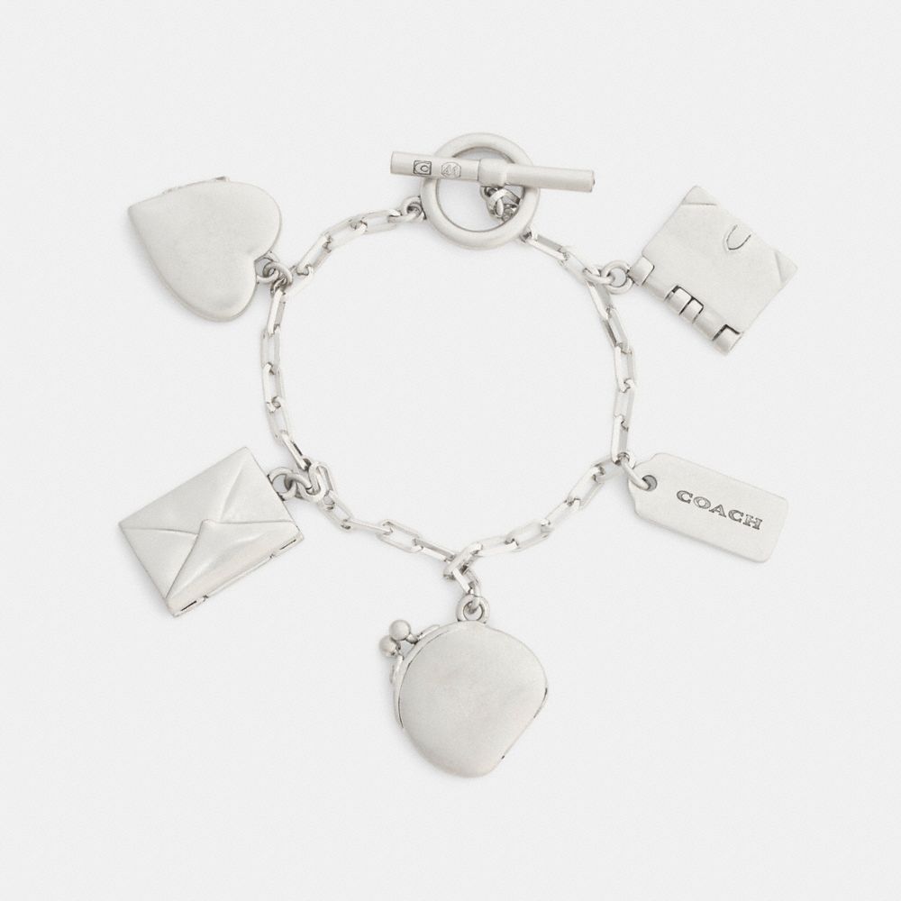 Женские аксессуары Coach Heart And Book Charm Bracelet — фото 2