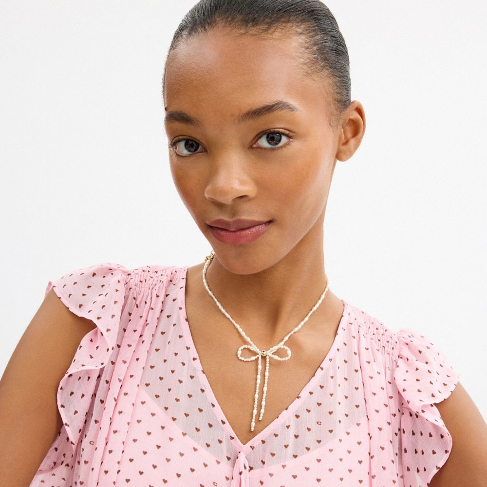 Coach Pearl Bow Choker Necklace — фото 3
