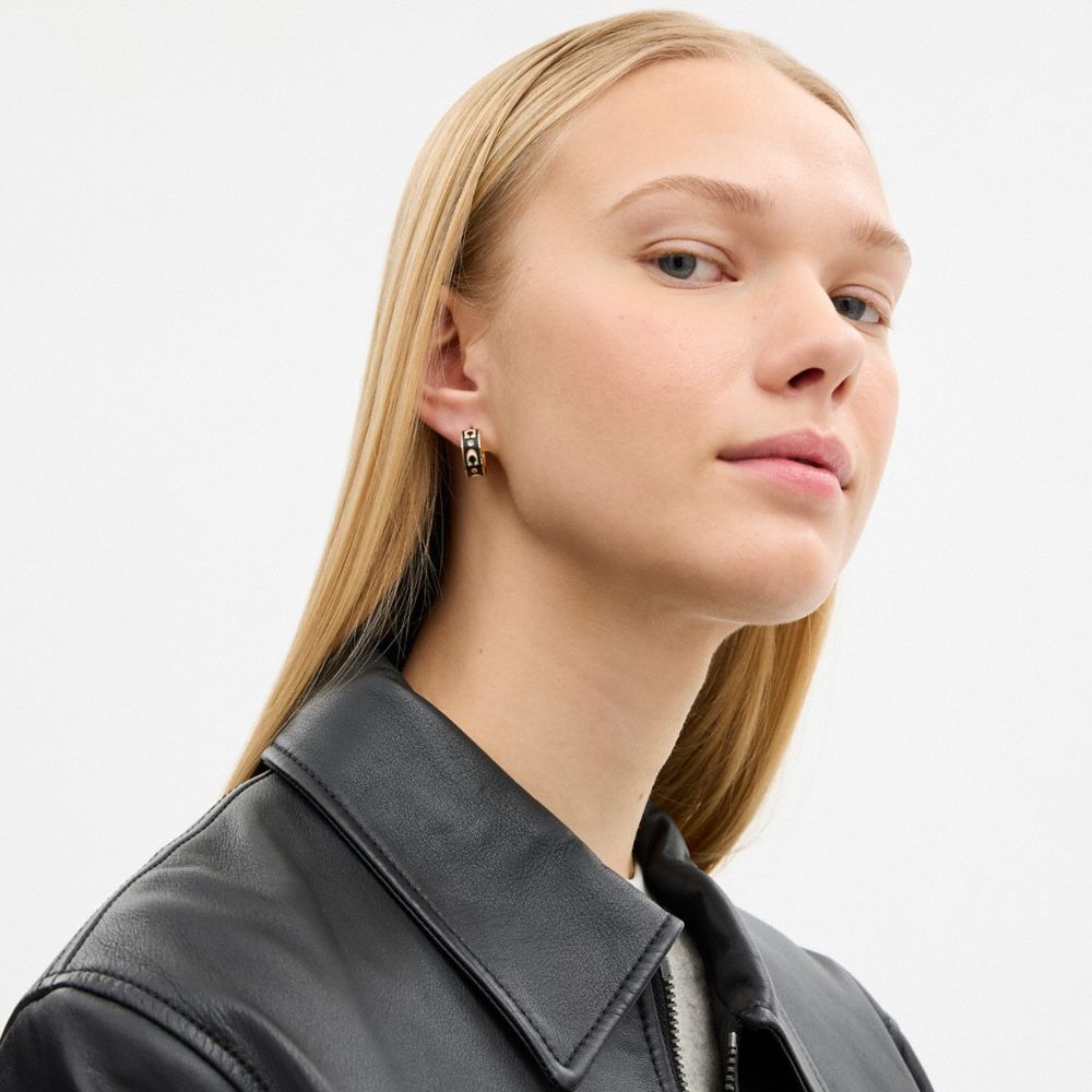 COACH®,Repeated C Huggie Earrings,Hoops,Huggies,Cubic Zirconia,Enamel,Glass,Gem Embellishment,Logo,Brass,Casual,Black,Detail View