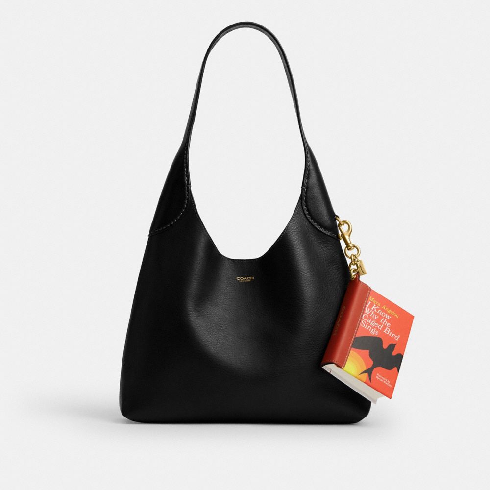 COACH®,I Know Why The Caged Bird Sings By Maya Angelou Book Bag Charm,,Angle View