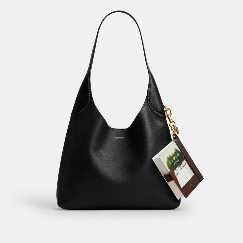 COACH®,The Forest Of Wool And Steel By Natsu Miyashita Book Bag Charm,,Angle View