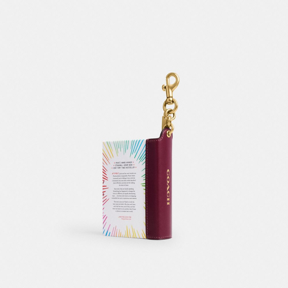 Женские брелоки Coach I'll Give You The Sun By Jandy Nelson Book Bag Charm — фото 2