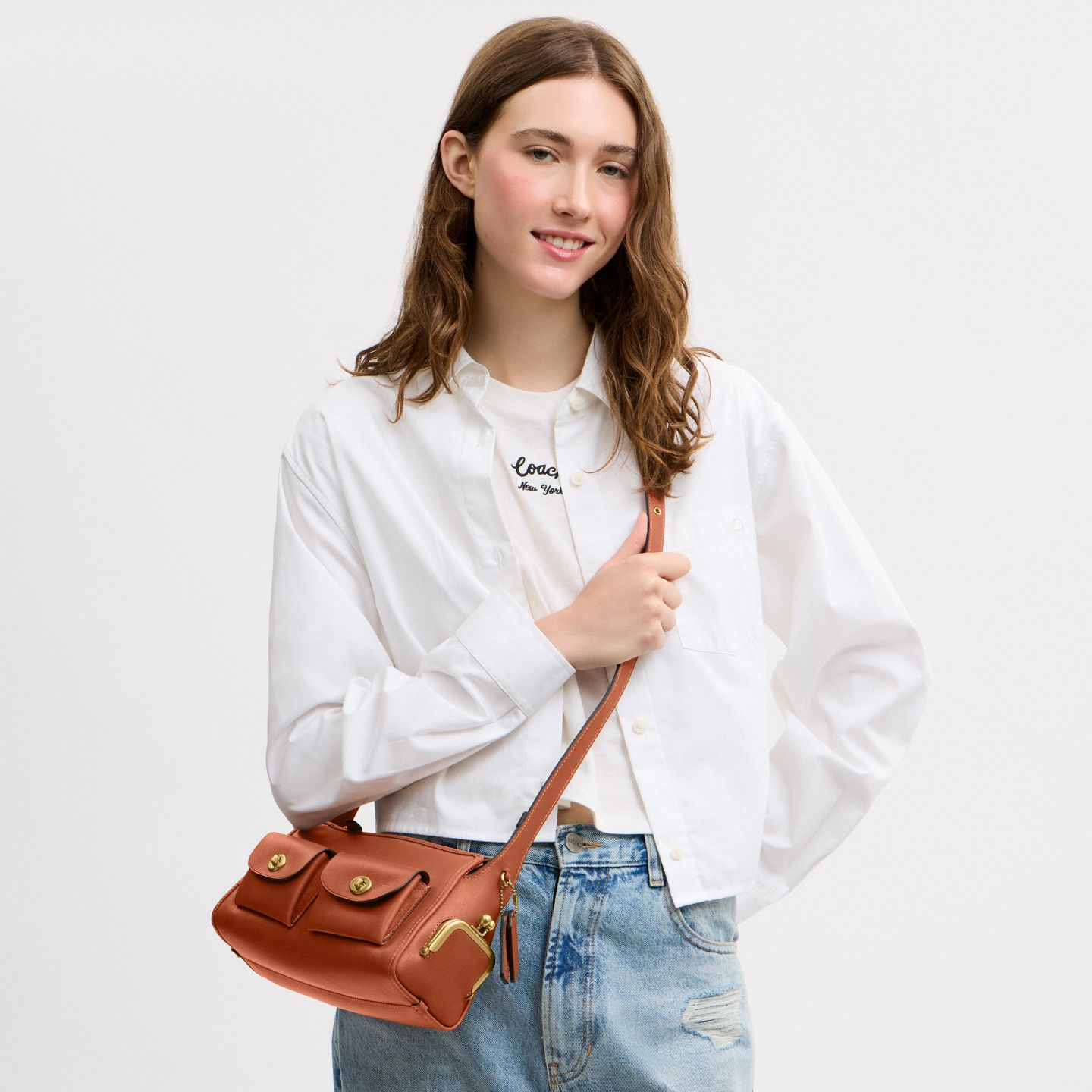 Женская сумка Coach Turnlock Haversack Bag 27, цвет: Латунный / Янтарный коричневый — фото 6