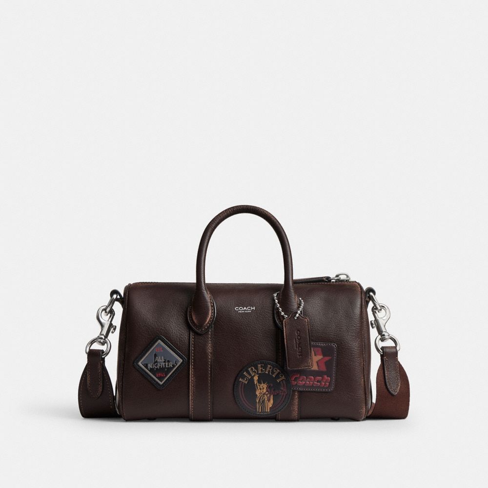 COACH®,Compass Bag 25 In Loved Leather With Stickers,,Front View