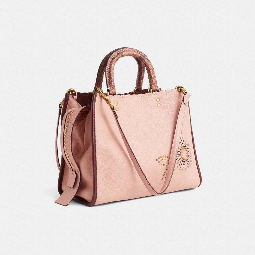COACH®,Upcrafted Rogue Bag With Snakeskin Tea Rose Rivets,Pink,Angle View