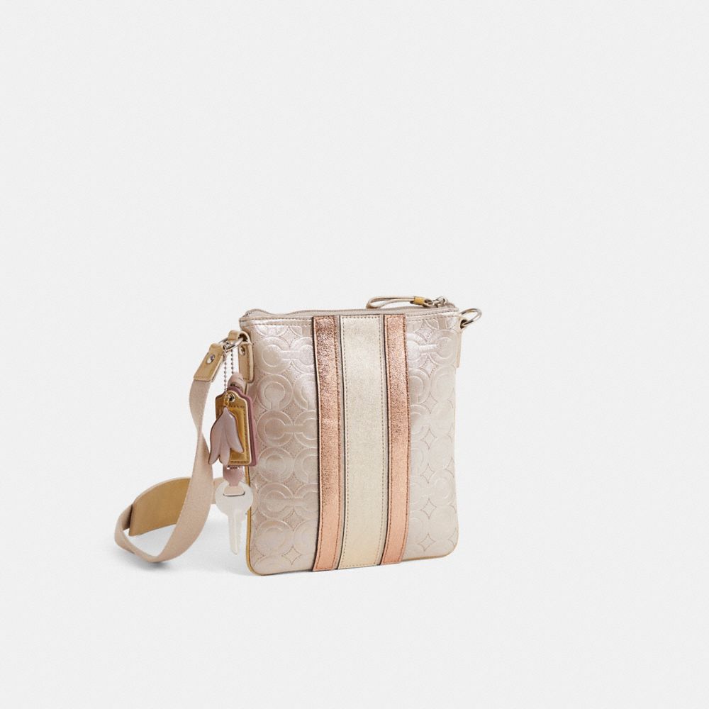 COACH®,Upcrafted Mia Embossed Op Art Swingpack,,Angle View