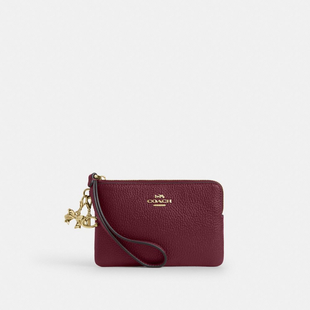 COACH®,Wristlet Angolare Con Zip E Charms,Bustina da polso piccola,Oro/Ciliegia Scuro,Front View