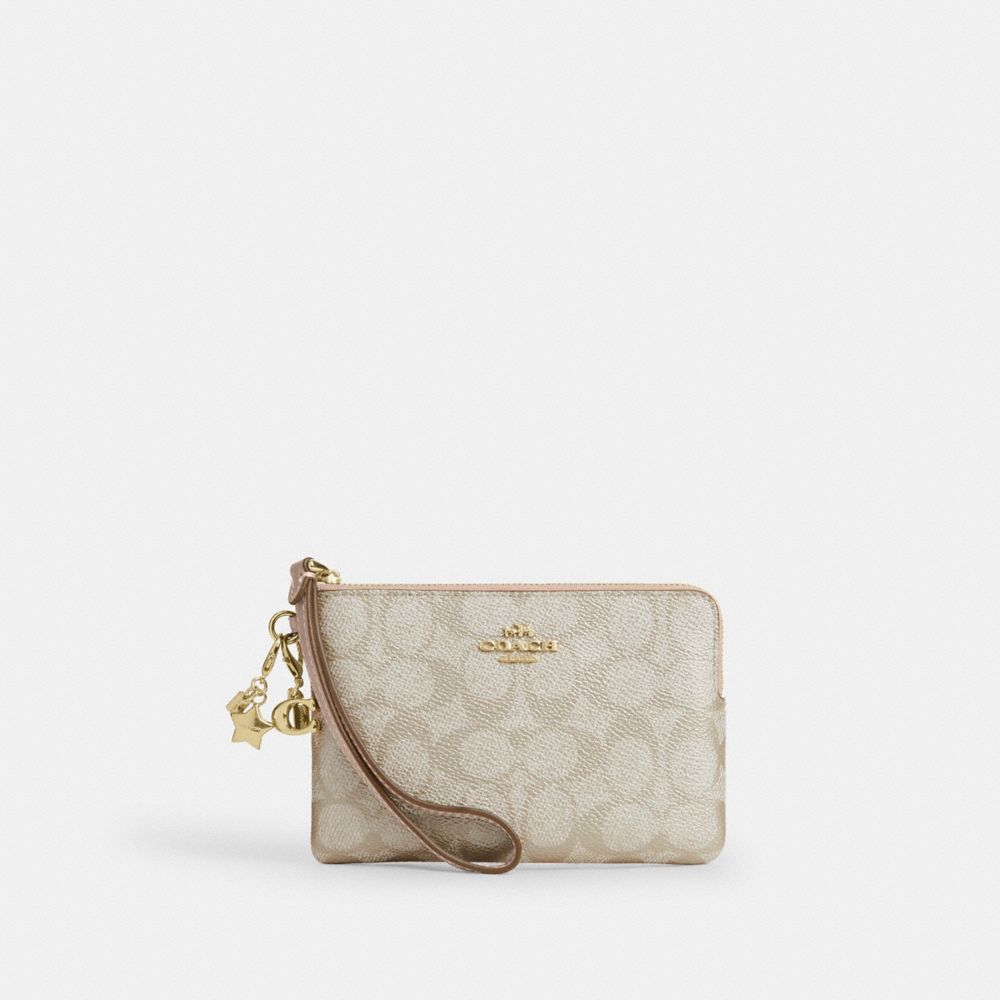 COACH®,Boxed Corner Zip Wristlet In Signature Canvas With Charms,,Front View
