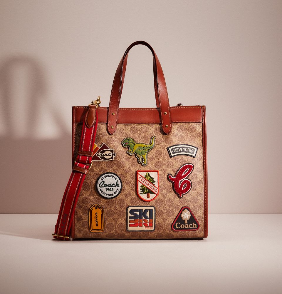 Field Tote 40 in Signature Canvas with Souvenir Patches and Pins