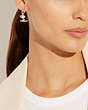 COACH®,COACH X PEANUTS SNOOPY SKI HUGGIE EARRINGS,Brass,Gold/Multi,Detail View