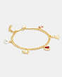 COACH®,SIGNATURE STONE AND HEART CHARM BRACELET,Gold/Red,Front View