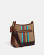 COACH®,DEMPSEY FILE BAG IN SIGNATURE JACQUARD WITH STRIPE AND COACH PATCH,Medium,Gold/Khaki/Redwood Multi,Angle View