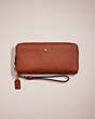 COACH®,RESTORED CONTINENTAL WALLET,Crossgrain Leather,Brass/1941 Saddle,Front View