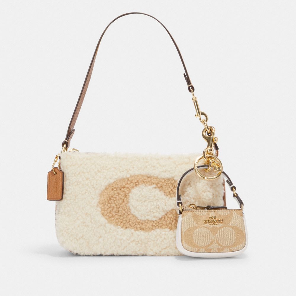 COACH®,MINI NOLITA BAG CHARM IN SIGNATURE CANVAS,Mini,Gold/Light Khaki Chalk,Angle View