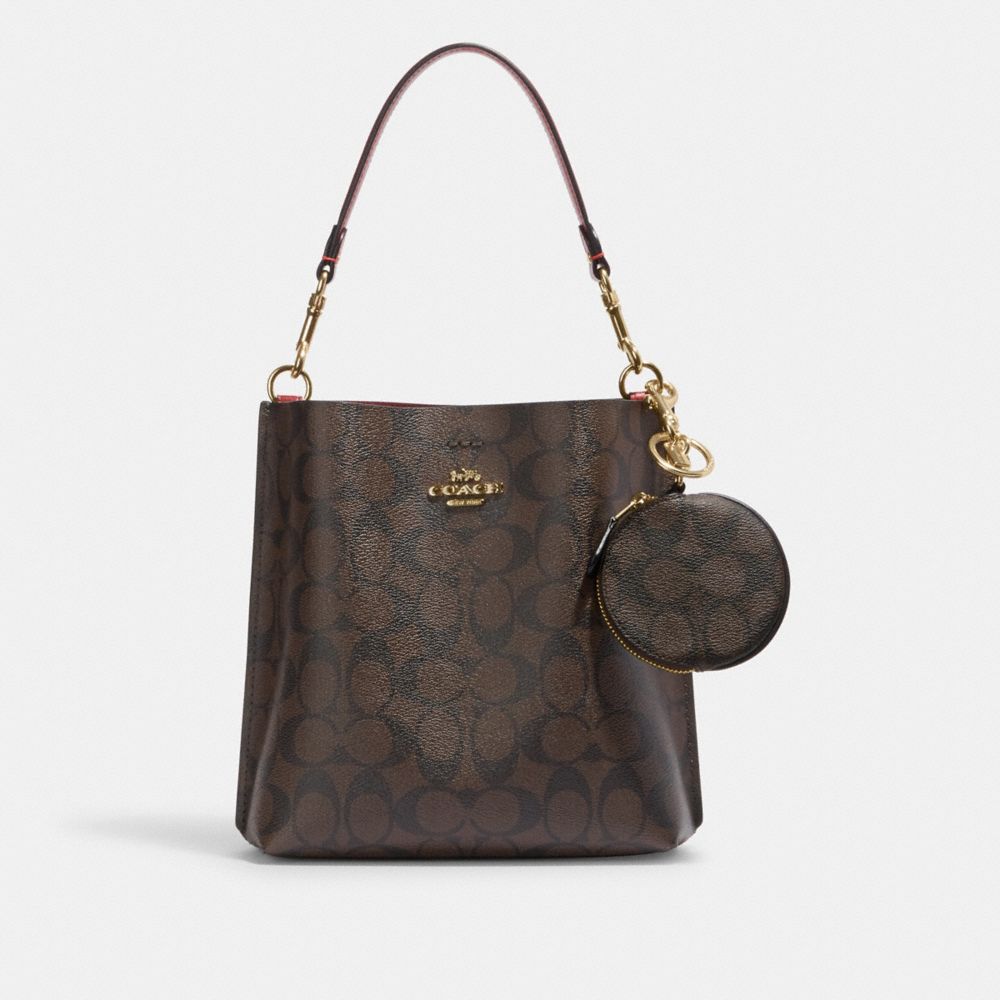 COACH®,Circular Coin Pouch Bag Charm In Signature Canvas,Leather,Canvas,Coin,PVC,Logo,Gold Metal,Casual,Brown,Angle View