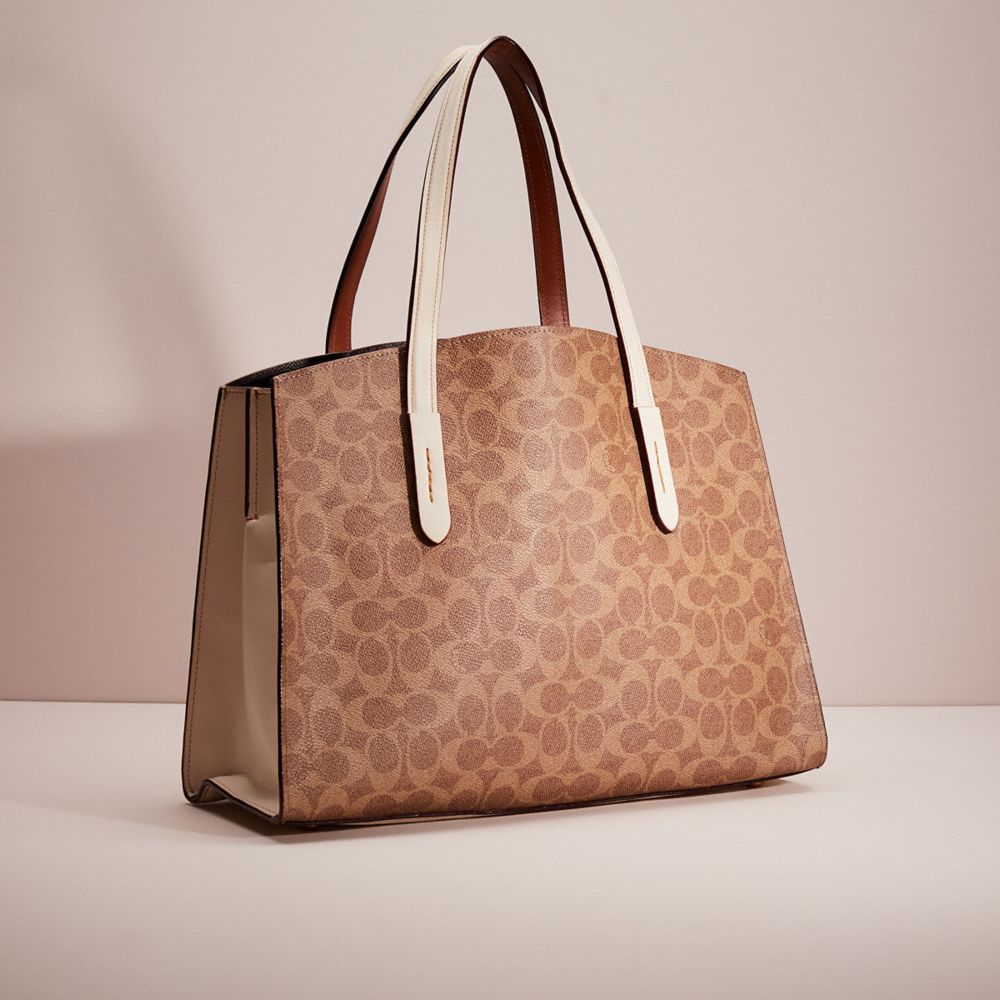 Coach charlie carryall in signature canvas new arrivals