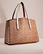 COACH®,UPCRAFTED CHARLIE CARRYALL IN SIGNATURE CANVAS,Signature Coated Canvas,Large,Brass/Chalk,Angle View