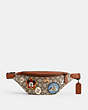 COACH®,DISNEY X COACH CHARTER BELT BAG 7 IN SIGNATURE TEXTILE JACQUARD WITH PATCHES,Signature Jacquard,Small,Pewter/Burnished Amber Multi,Front View