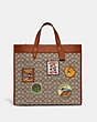 COACH®,DISNEY X COACH FIELD TOTE BAG 40 IN SIGNATURE TEXTILE JACQUARD WITH PATCHES,Jacquard,X-Large,Cocoa Multi,Front View