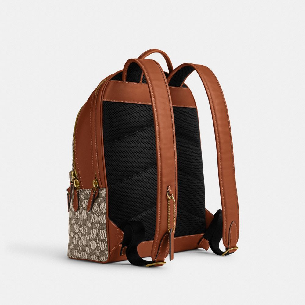 COACH®,DISNEY X COACH CHARTER BACKPACK IN SIGNATURE TEXTILE JACQUARD WITH PATCHES,X-Large,Cocoa Jacquard,Angle View