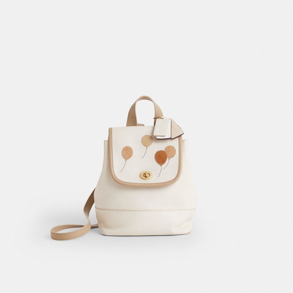 COACH®,Upcrafted Turnlock Backpack,Cream,Front View