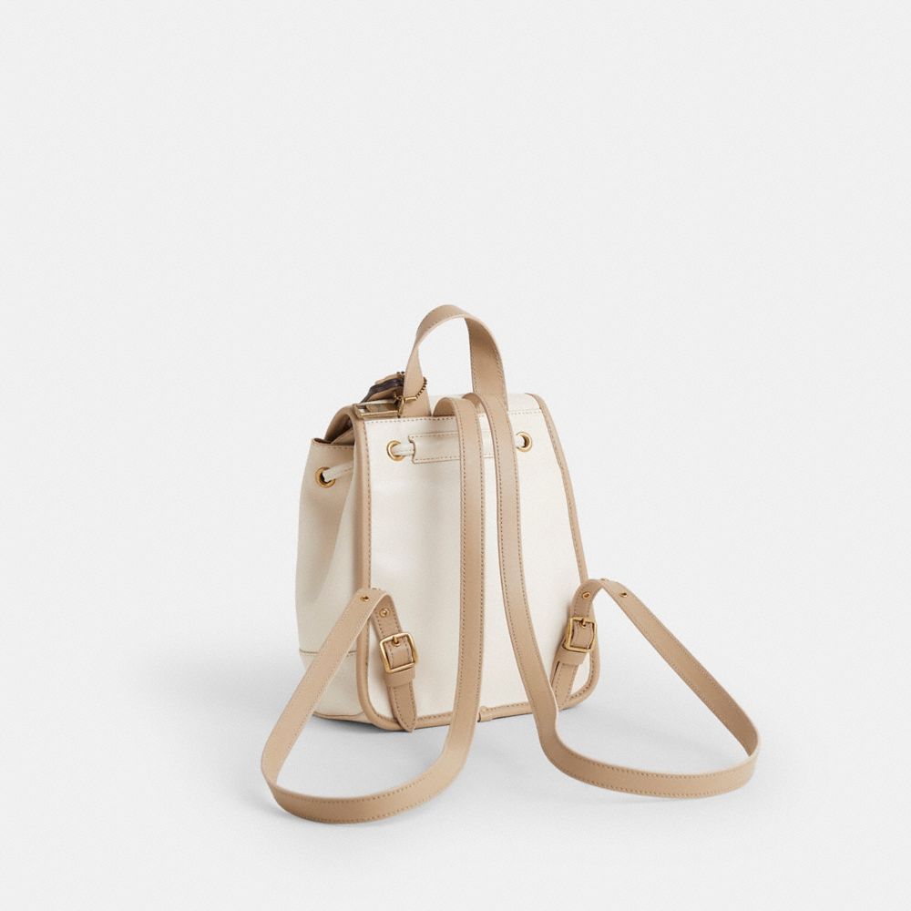 COACH®,Upcrafted Turnlock Backpack,Cream,Angle View