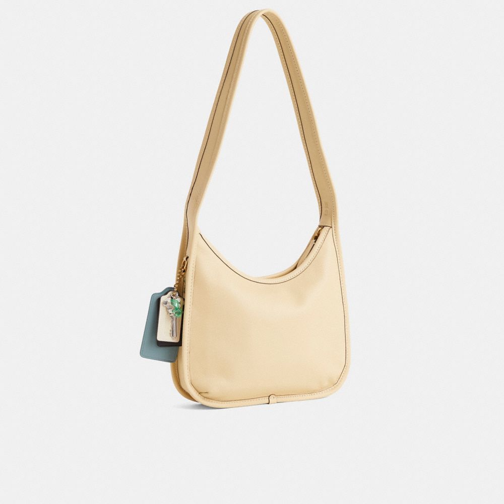 COACH®,Reloved Curve Zip Bag,,Angle View