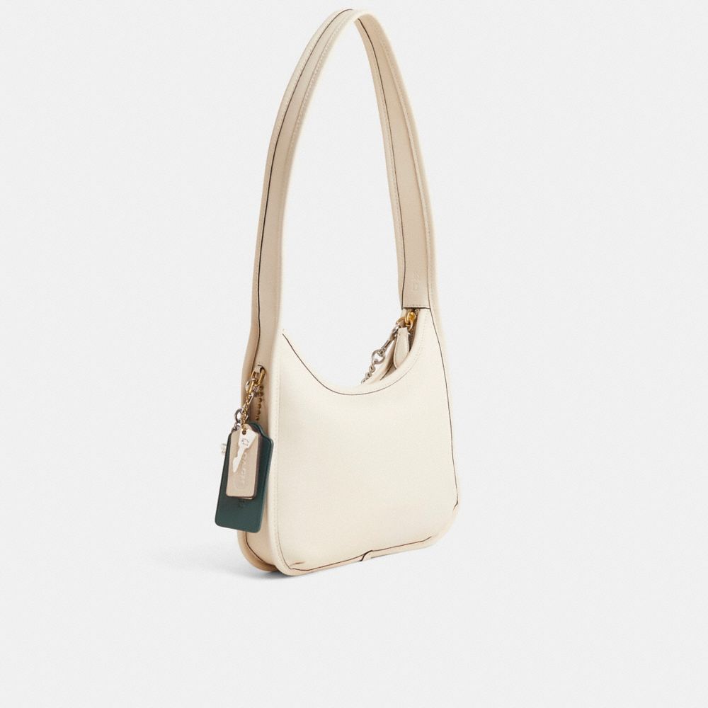 COACH®,Reloved Curve Zip Bag,,Angle View