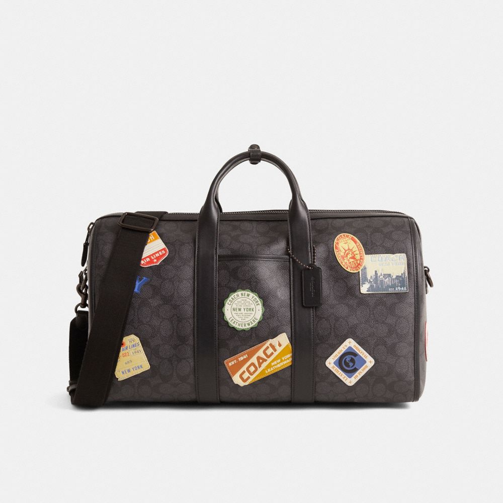 COACH®,Restored Gotham Duffle Bag 45 In Signature Canvas With Patches,,Front View