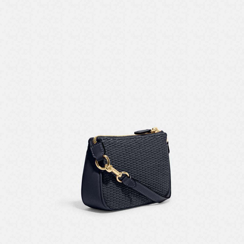 In loooove with this baby Nolita 15 In Straw by @coach! It's the perfe