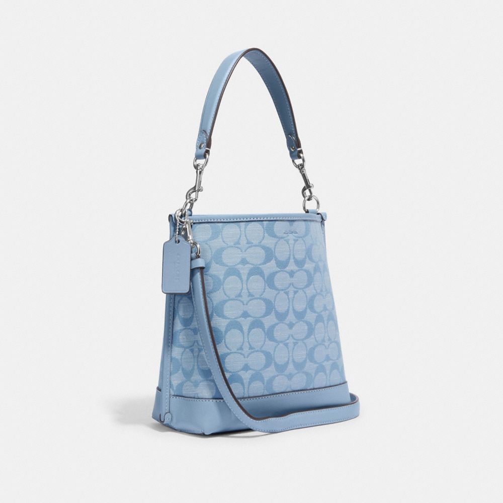 COACH®,MOLLIE BUCKET BAG 22 IN SIGNATURE CHAMBRAY,Denim,Medium,Silver/Cornflower Multi,Angle View