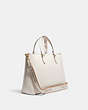 COACH®,LOGAN CARRYALL,Leather,Gold/Chalk Multi,Angle View