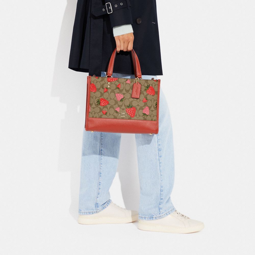 COACH®,Dempsey Carryall Bag In Signature Canvas With Wild Strawberry Print,,Detail View