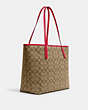 COACH®,CITY TOTE IN SIGNATURE CANVAS WITH WILD STRAWBERRY,X-Large,Silver/Khaki/Electric Red,Angle View