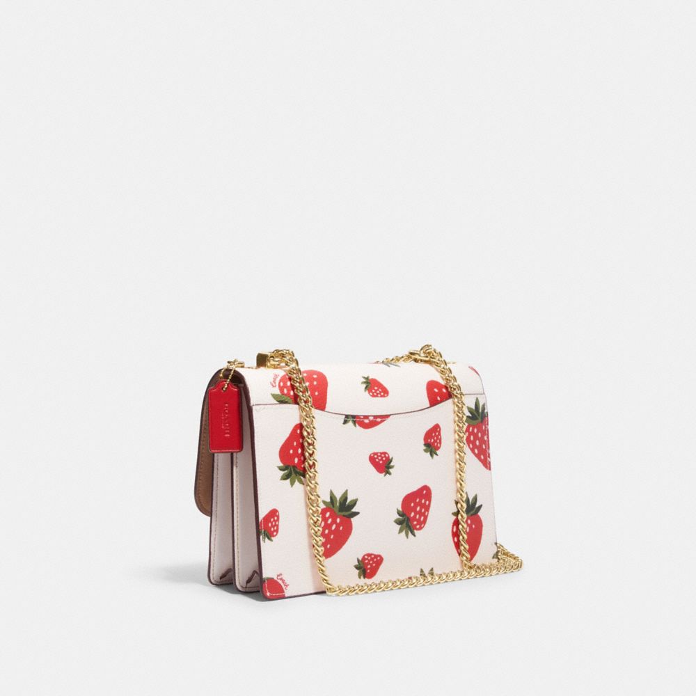 COACH®,KLARE CROSSBODY BAG WITH WILD STRAWBERRY PRINT,Medium,Gold/Chalk Multi,Angle View