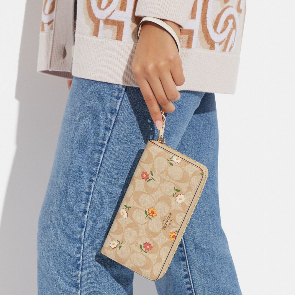 COACH®,LONG ZIP AROUND WALLET IN SIGNATURE CANVAS WITH NOSTALGIC DITSY PRINT,Mini,Gold/Light Khaki Multi,Detail View