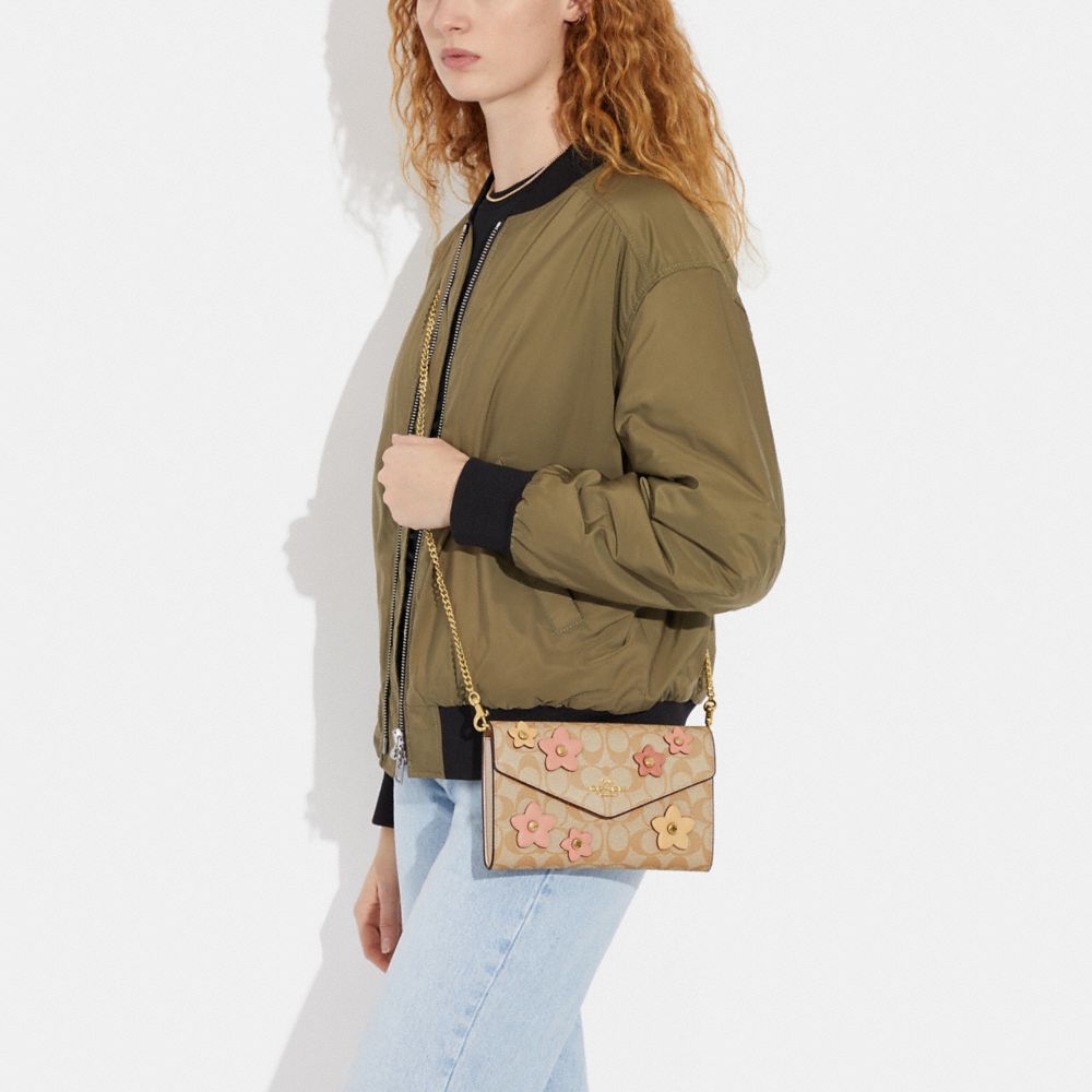 COACH®,Envelope Clutch Crossbody In Signature Canvas With Floral Applique,,Detail View