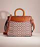 COACH®,RESTORED ROGUE IN SIGNATURE TEXTILE JACQUARD,Glovetanned Leather,Large,Brass/Cocoa Burnished Amb,Front View