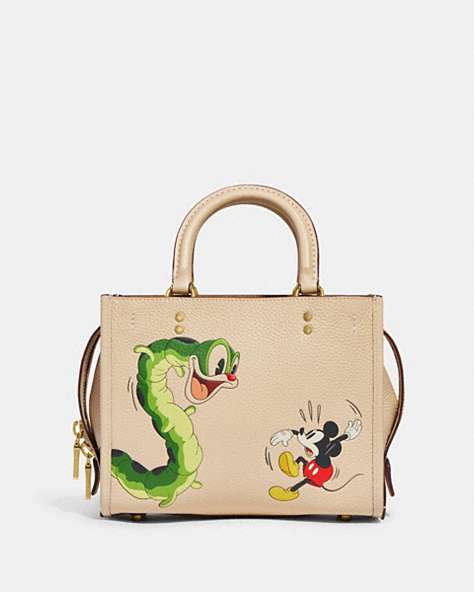 COACH®,DISNEY X COACH ROGUE 25 IN REGENERATIVE LEATHER WITH MICKEY MOUSE AND CATERPILLAR,Smooth Leather,Medium,Brass/Ivory,Front View