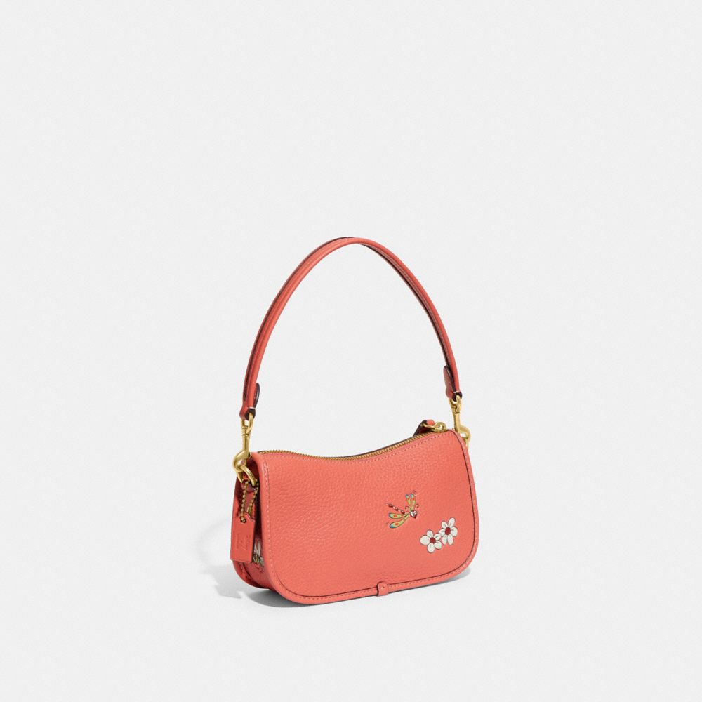 COACH®,DISNEY X COACH SWINGER BAG 20 IN REGENERATIVE LEATHER WITH MICKEY MOUSE AND FLOWERS,Glovetanned Leather,S...,Brass/Burnt Coral,Angle View