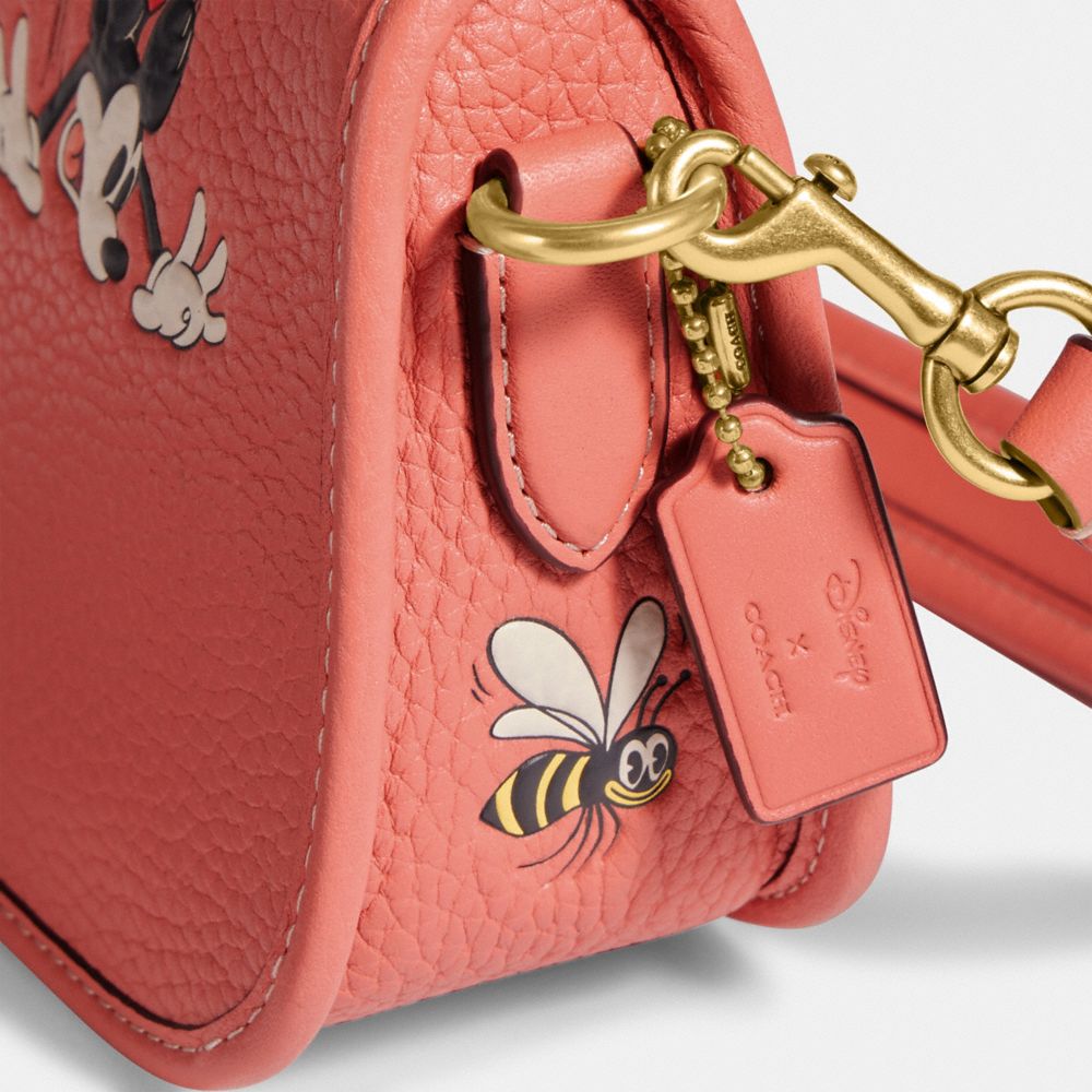 COACH®  Disney X Coach Swinger 20 In Regenerative Leather With Mickey  Mouse And Flowers