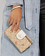 COACH®,PHONE WALLET IN SIGNATURE CANVAS WITH NOSTALGIC DITSY PRINT,Gold/Light Khaki Multi,Detail View