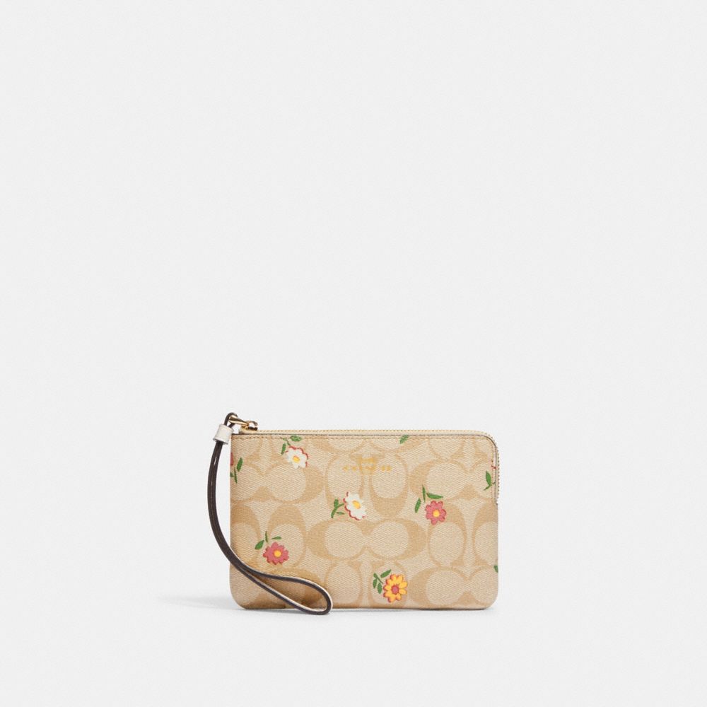 COACH®,CORNER ZIP WRISTLET IN SIGNATURE CANVAS WITH NOSTALGIC DITSY PRINT,Mini,Gold/Light Khaki Multi,Front View