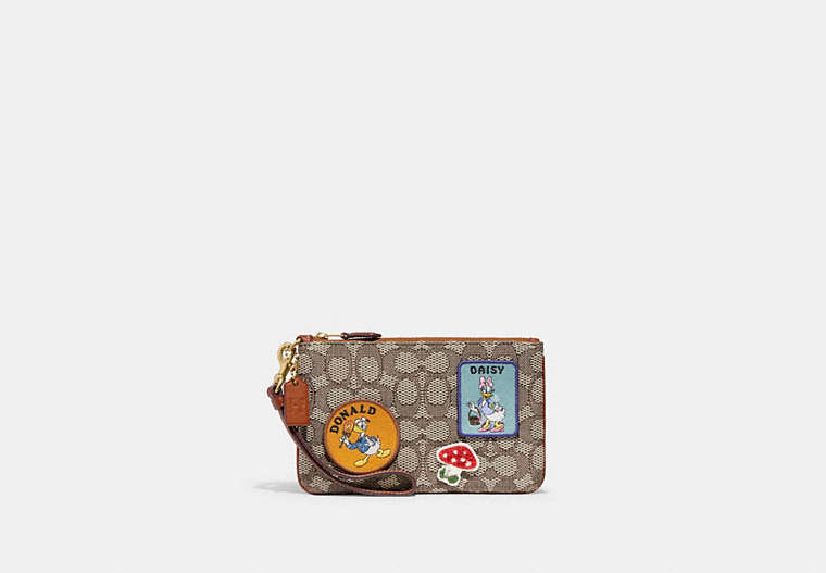 COACH®,DISNEY X COACH SMALL WRISTLET IN SIGNATURE TEXTILE JACQUARD WITH PATCHES,Signature Jacquard,Mini,Brass/Cocoa Burnished Amb,Front View