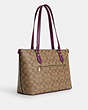 COACH®,GALLERY TOTE BAG IN SIGNATURE CANVAS,pvc,Large,Everyday,Gold/Khaki/Deep Berry,Angle View