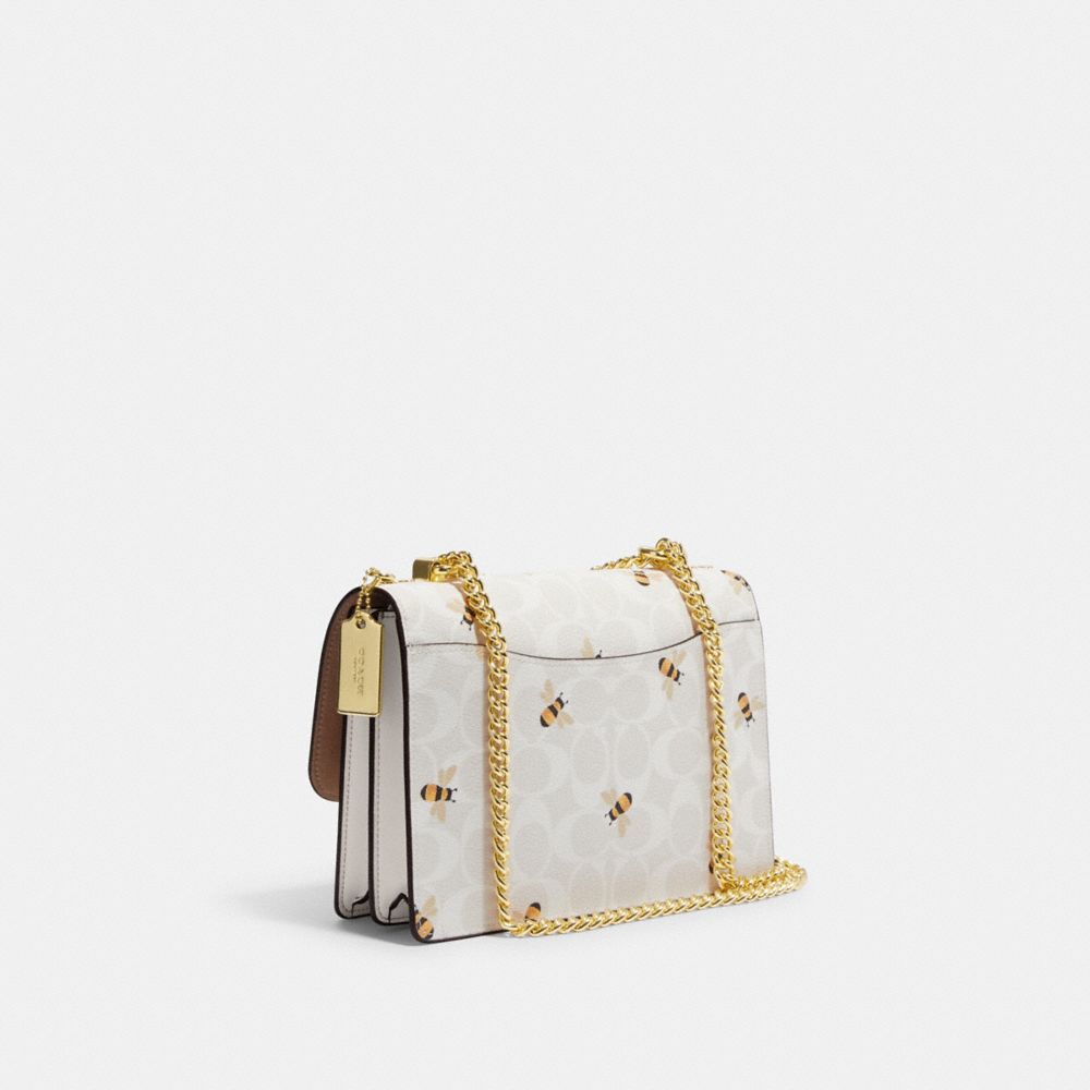 COACH®,Klare Crossbody Bag In Signature Canvas With Bee Print,,Angle View