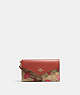 COACH®,TRAVEL ENVELOPE WALLET IN SIGNATURE CANVAS WITH WILD STRAWBERRY PRINT,Gold/Khaki Multi,Front View