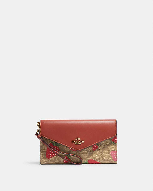 COACH: envelope clutch in leather and coated canvas with logo