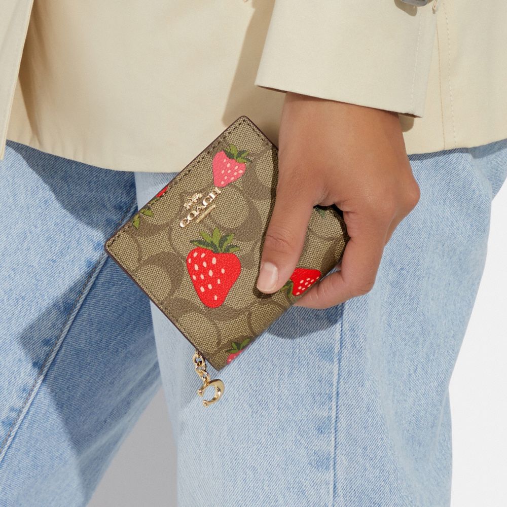 COACH®,Snap Wallet In Signature Canvas With Wild Strawberry Print,,Detail View